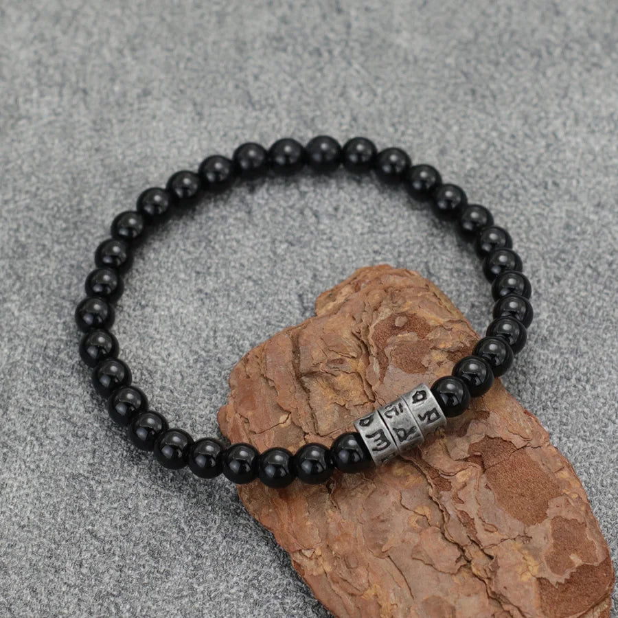 Pulsera Vikinga de Ónix Negro con Grabado Sánscrito