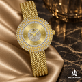 Detalle de carátula y brazalete trenzado del reloj Gold